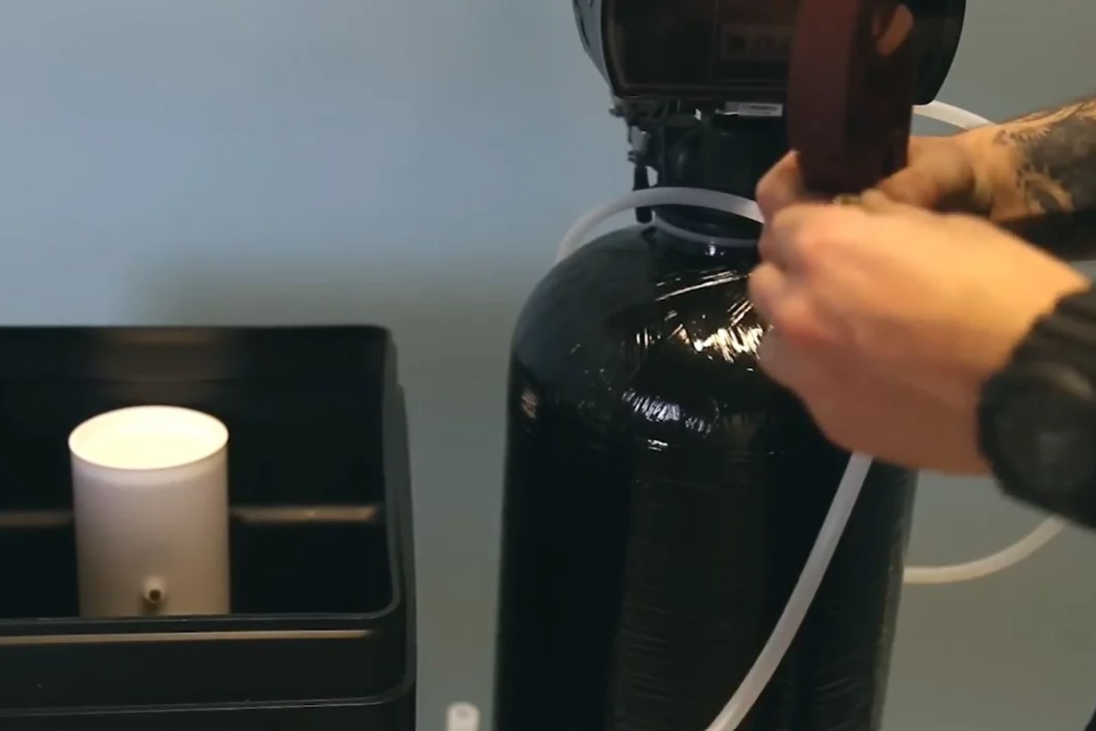 Whole-home water softener installed in a Texas garage